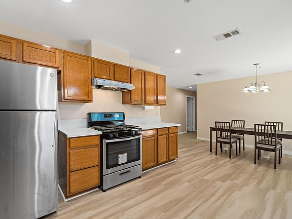 Discover modern comfort in our inviting kitchen, featuring brand-new appliances for your convenience and enjoyment.