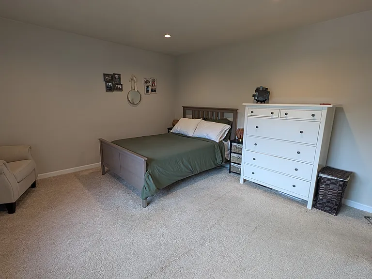The bed in this image is a full size bed (54" x 75"), which is just a little smaller than a queen bed (60" x 80").