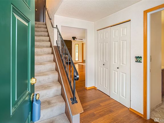 Beautiful new wood floors! Completely remodeled power room to the right as you enter.