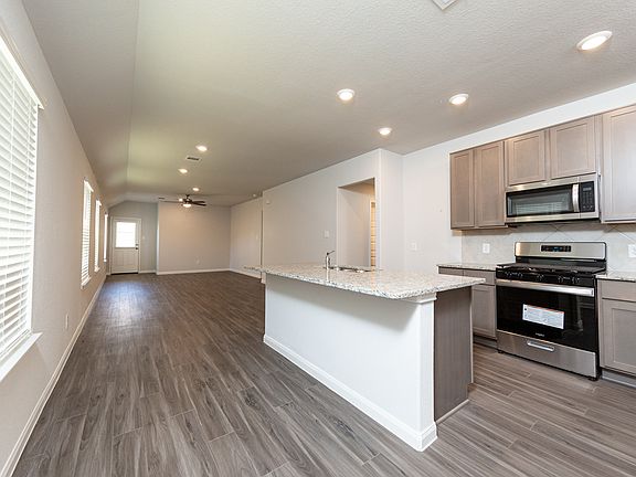 Kitchen to Dining Area and Family Room
