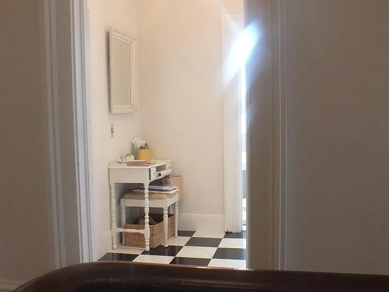 Entry to apartment with marble floors.
