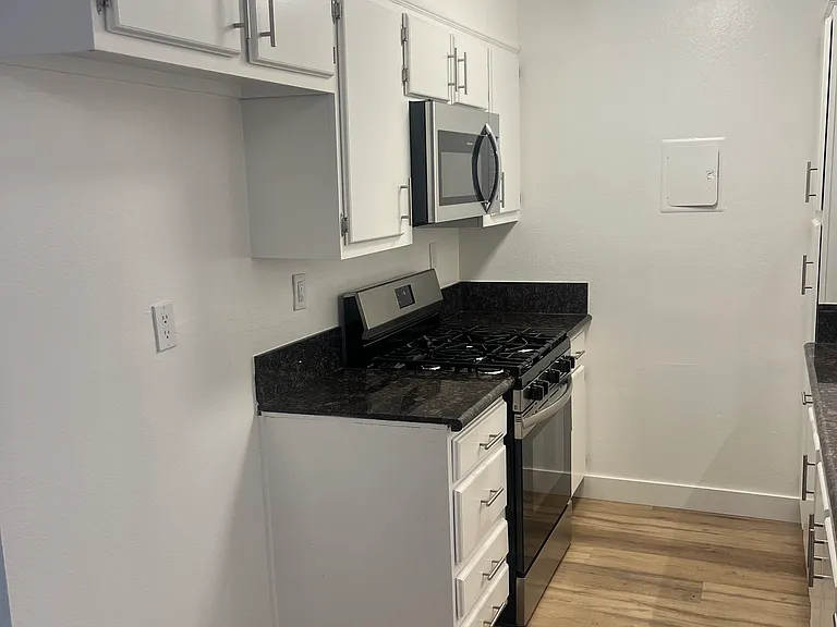 Unit 26 new stainless steel stove and microwave