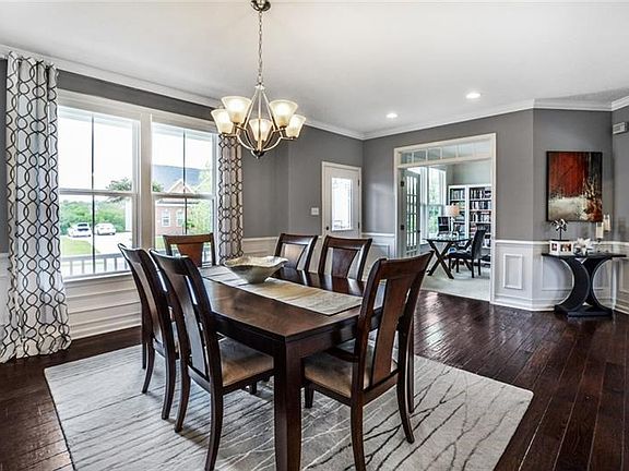 Furnishings will be showcased in the spacious dining room with wainscoting accenting the walls and further enhanced with crown m