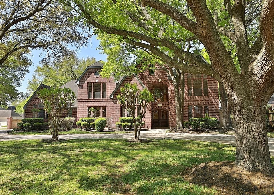 Gorgeous approximately 1/2 acre lot with massive beautiful trees! Circular Dr plus secondary driveway! 5 or 6 bedrooms! Study down has a bathroom and closet!