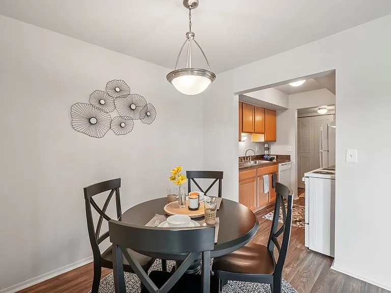 Spacious dining room area at Drawbridge Apartments in Harrison Township, MI.