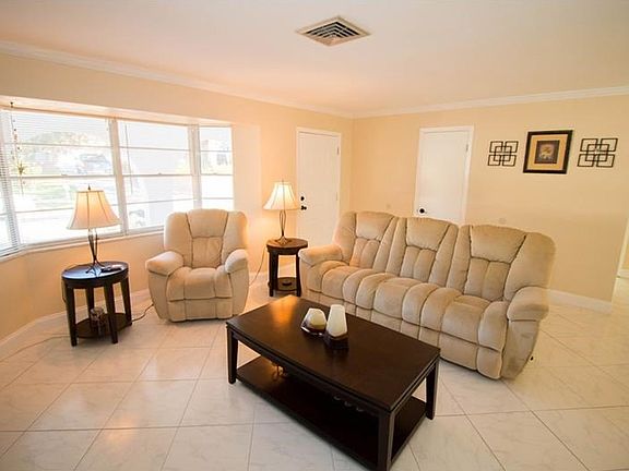 View of the living room.  Door on left is the front door.