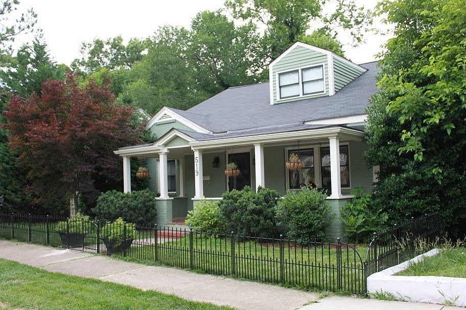 This all brick bungalow is an engaging architectural potpourri.