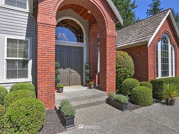 Newly painted double door entry and professional landscaping welcome your guests. 
