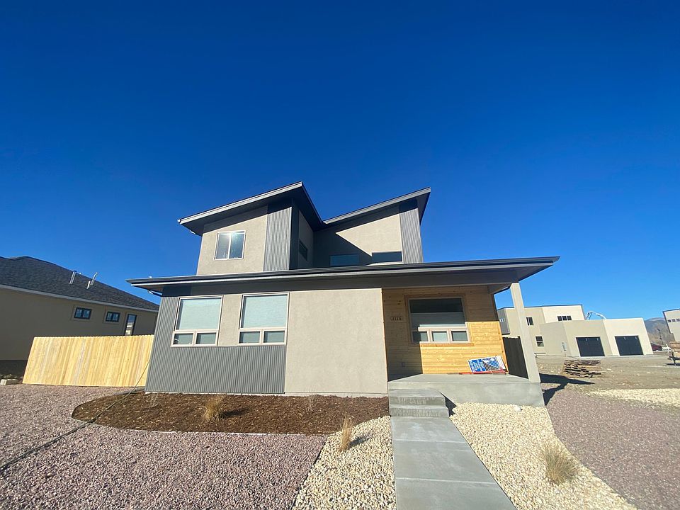 Modern new home with maintenance landscaping