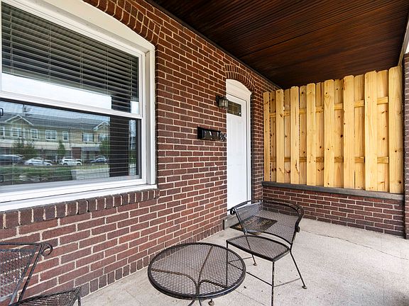 Relax on the covered front porch while watching the local parades and street life!