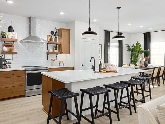 Kitchen with pendant lighting and floating shelves