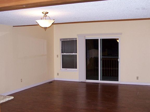Large/bright living room with sliding door to balcony