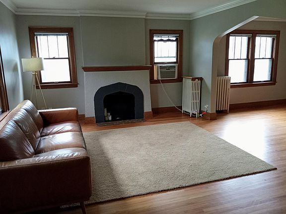 Large living room. Crown molding. New Paint. Wood floors recently finished. South facing windows.