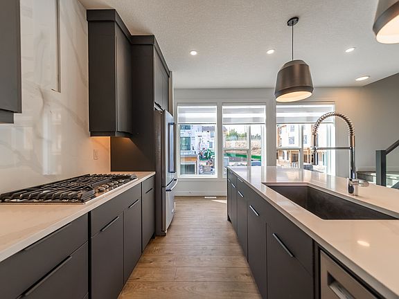 A photo of the kitchen of the Stanley model in Crown Park by Brookfield Residential