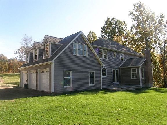 BACK ANGLE OF 3 CAR GARAGE & BONUS ROOM ABOVE