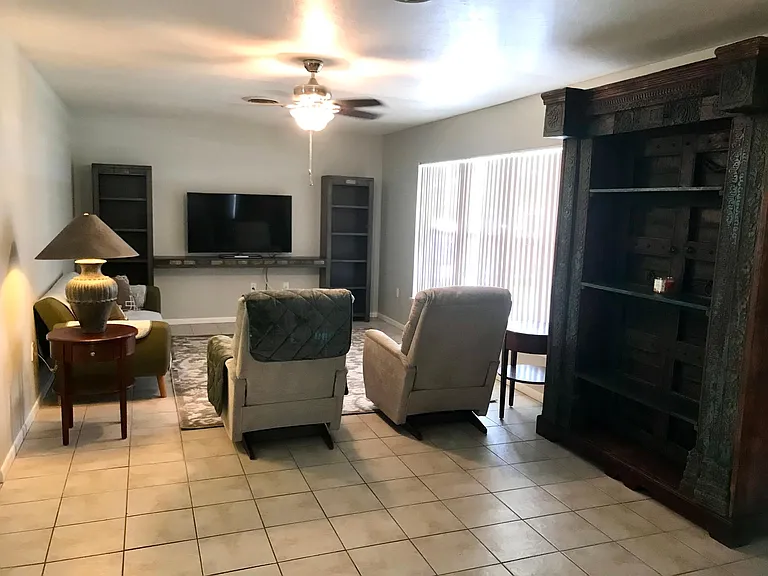 Comfy LaZBoy recliners, MCM sofa and 55" SmartTV