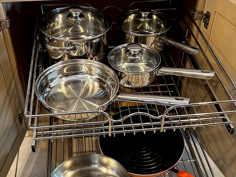 Stainless cookware on soft-close sliders