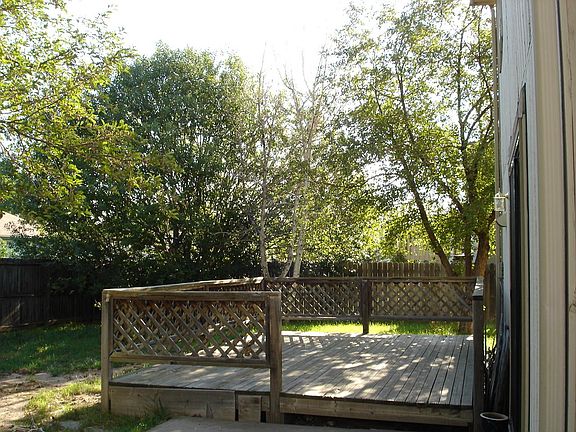 Deck and fenced backyard