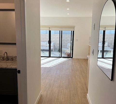 ground floor entry hall with powder room on left side