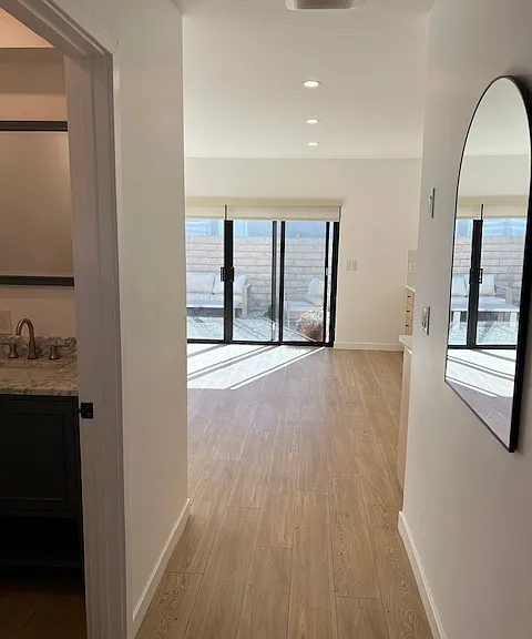 ground floor entry hall with powder room on left side