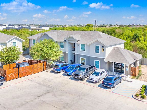 Exterior view of La Joya Apartments, located at the park's edge in Laredo, Texas, showcasing modern architecture and landscaping