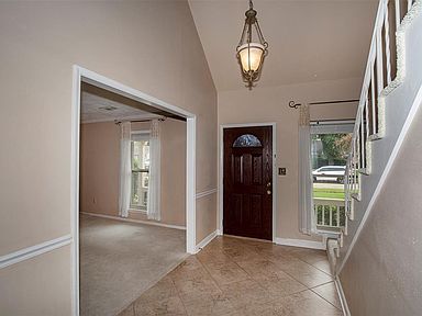 From this view of the entryway, you can see into the formal living room.