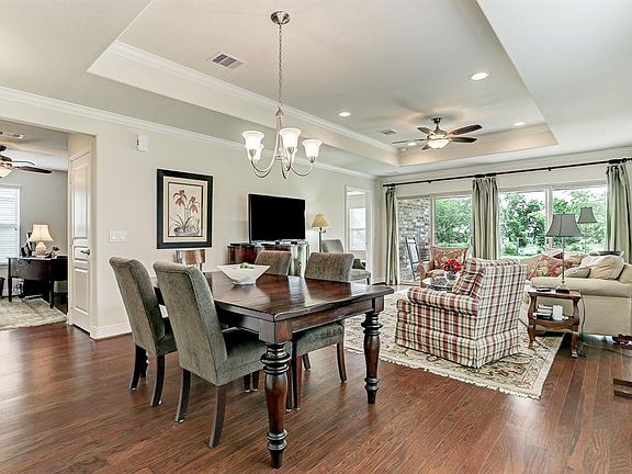 Another view of the main living area with a preview of the flex room. The master bedroom is at the back of the home.