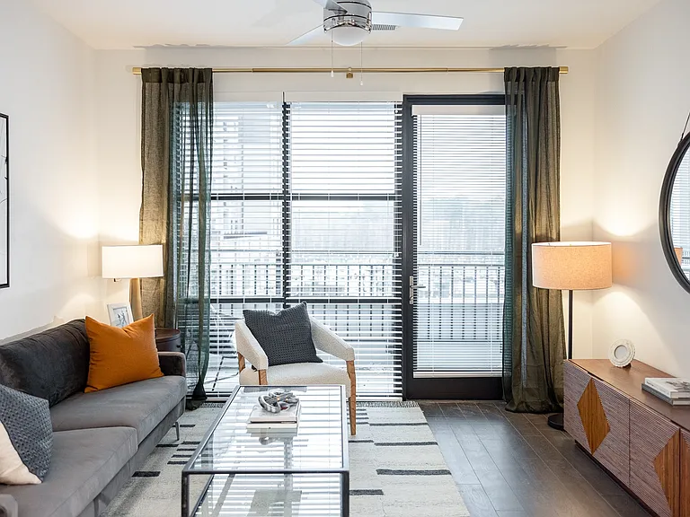 Relax in a cozy living space filled with natural light and stylish finishes.