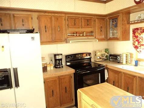 Kitchen boasts lots of cabinets.