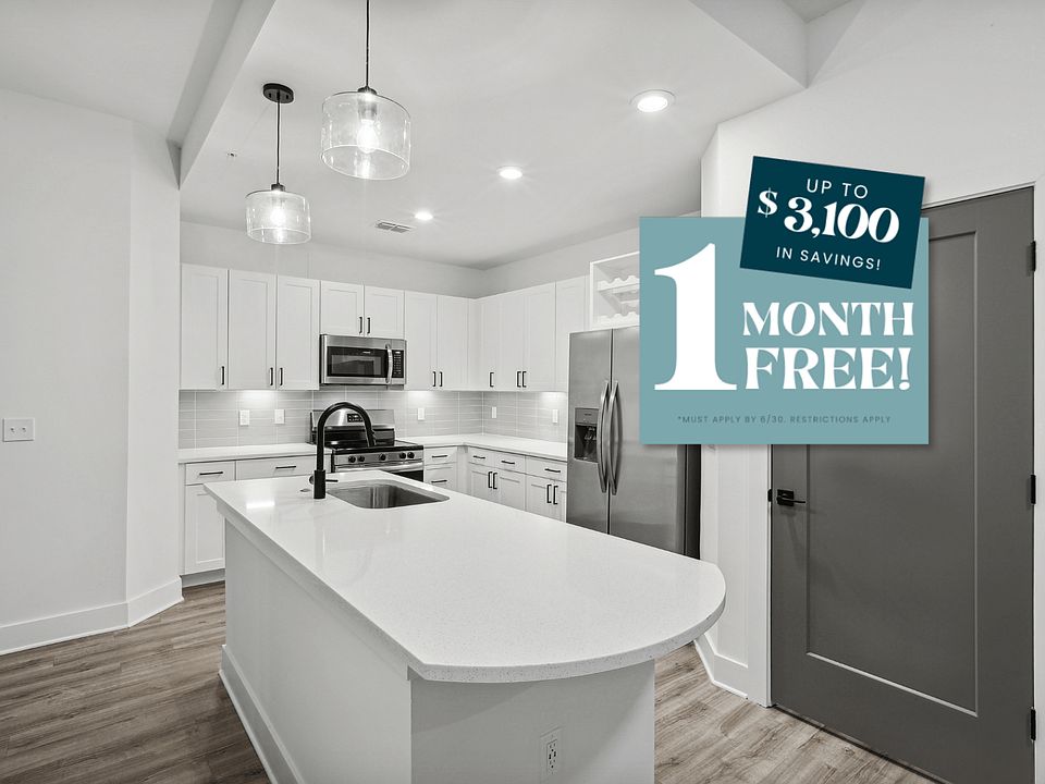 Kitchen with Quartz Countertop and Stainless Steel Appliances.