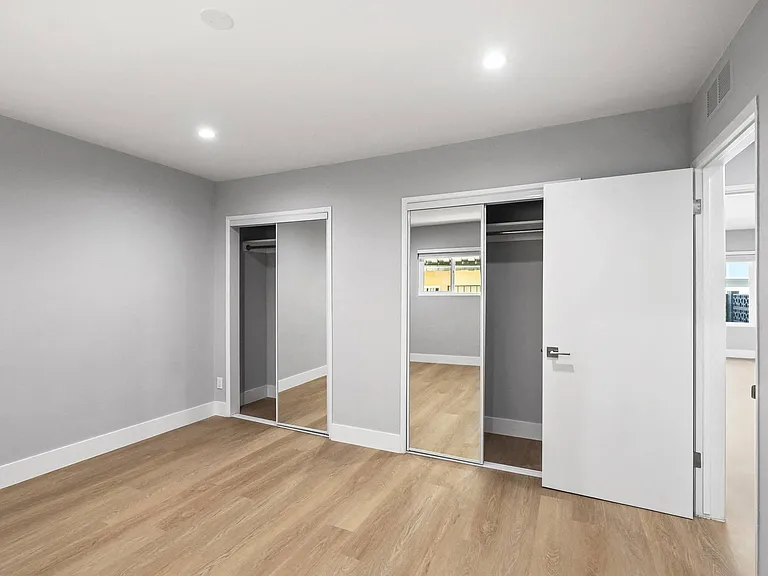 Bedroom with Two-Mirrored Closets