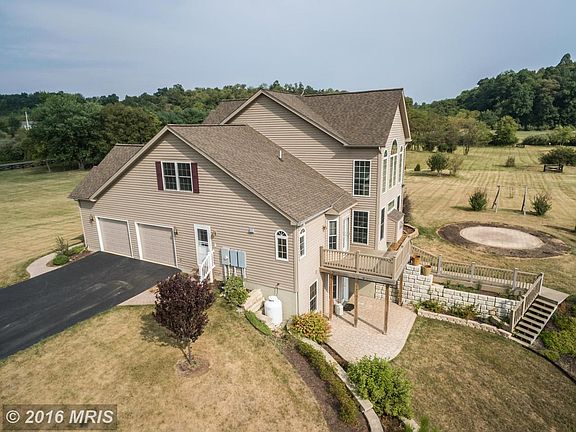 Side-loading, 2-car garage; shed