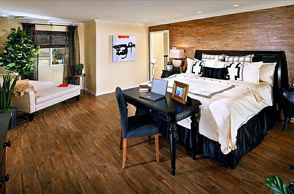 Spacious Master Suite with bed, desk, and reading nook
