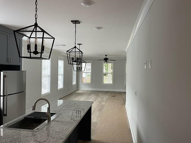 Open concept kitchen, dining and living