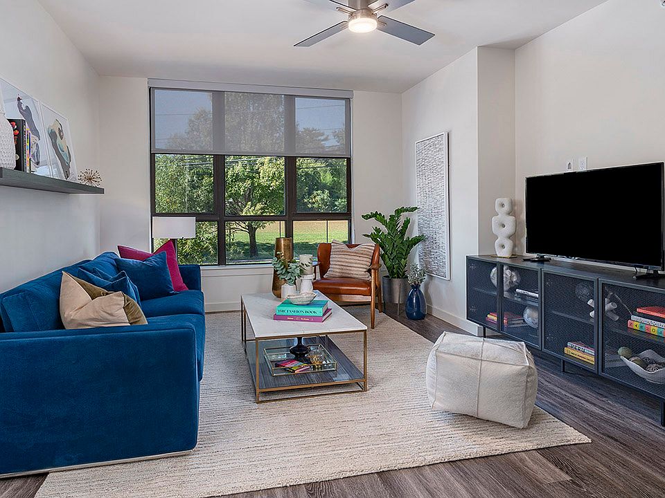 Apartment living room with wood-style flooring.