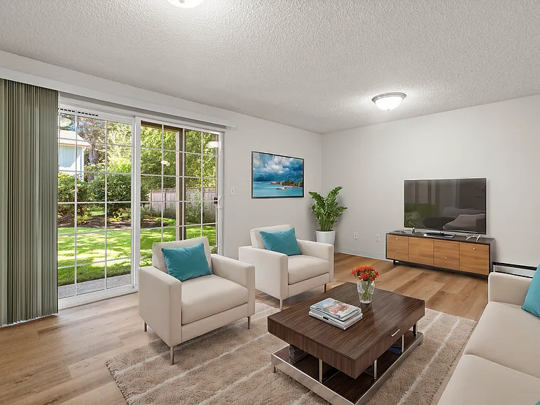 Inviting living room with patio access Inviting living room with patio access