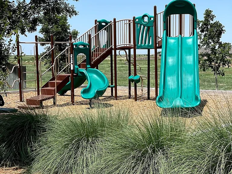 Small playground next to swimming pool