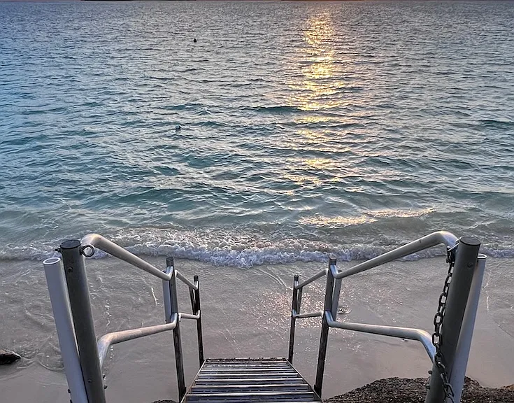 Step down to the beach at low tide (sand comes and goes)