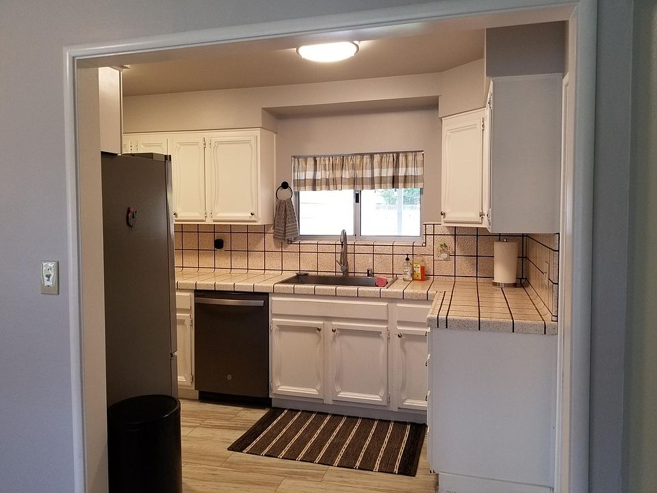 Kitchen features new all stainless appliances, new luxury vinyl flooring, and garbage disposal.