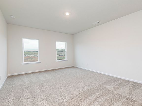 Master bedroom with double windows and ample space for all of your furniture.