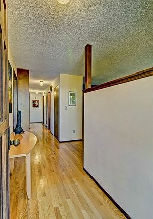 An expanse of gleaming hardwoods welcomes you! Formal entry with