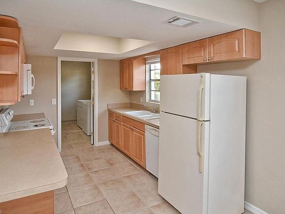 Kitchen with maple, wood cabinets.