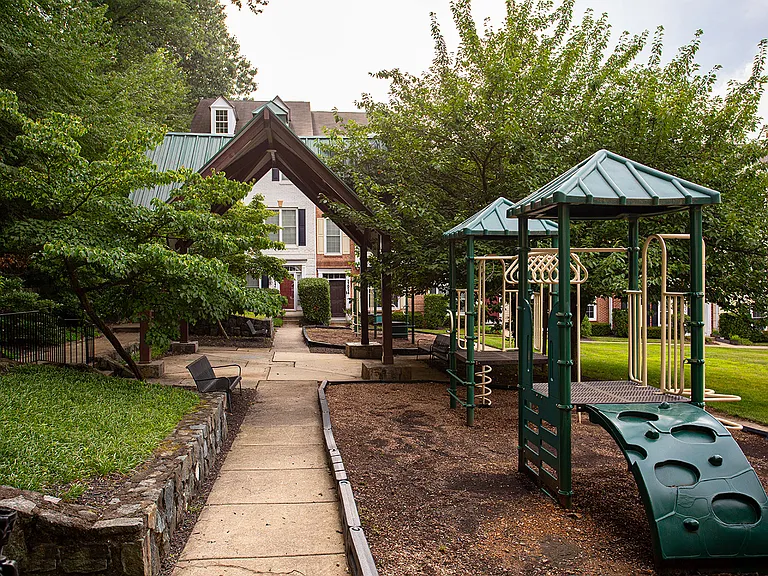 Mature trees, a pavilion and playground right by the front door, lots of greenery