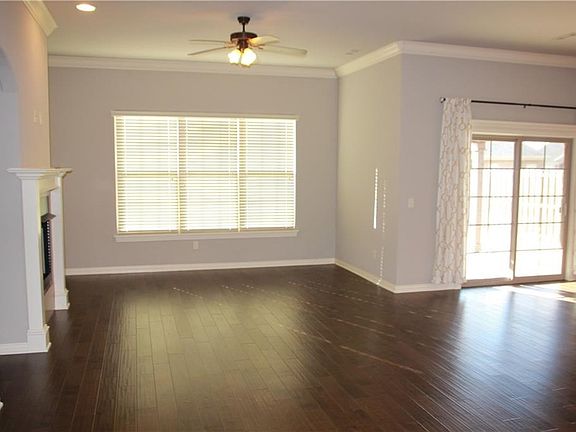 Lots of natural light on the backside of the house with beautiful dark wood floors.
