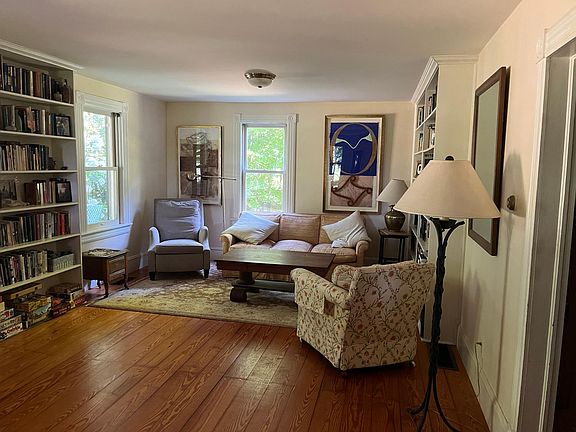 3 floor-to-ceiling built-in bookcases. House can come unfurnished.