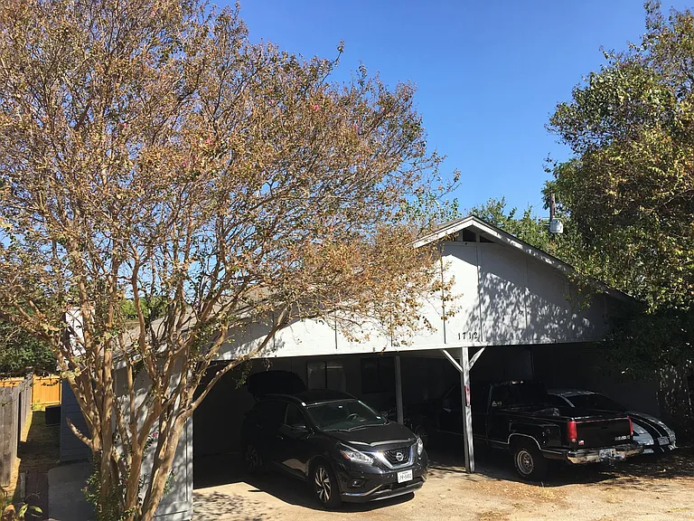 Bonus double sized carport for 2 cars for each unit of duplex. 4 cars covered total. Long driveway set back from street for privacy.