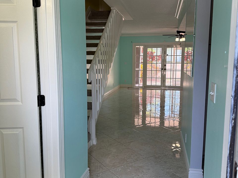 From the entry way, the Half Bathroom is on the left and the Kitchen is on the right.