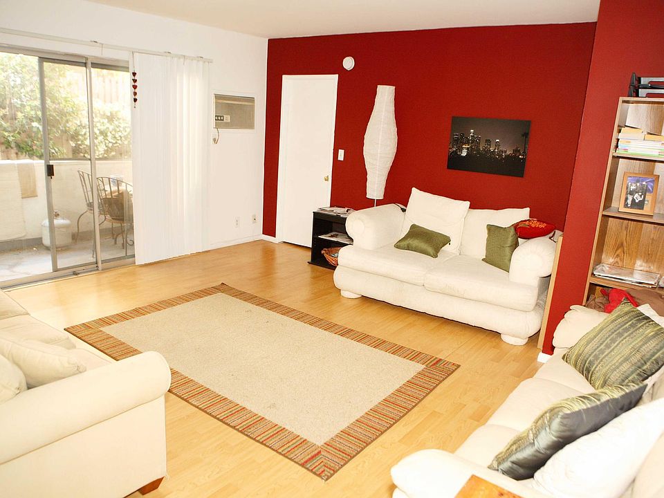 Shared living room with sliding glass doors to balcony.