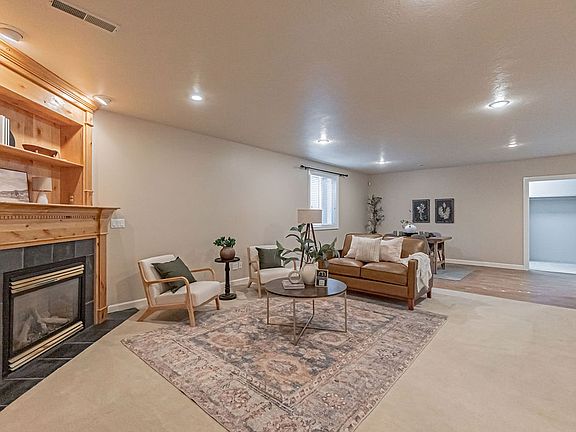 Open Floor Plan - Basement Family Room with Fireplace and Dining Area