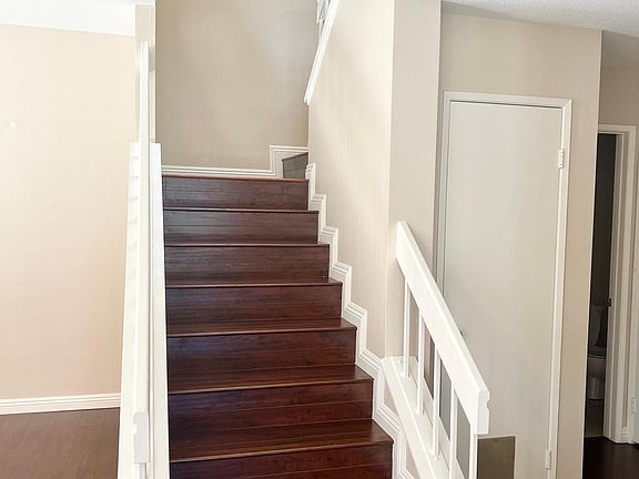 Staircase leading to bedrooms and full bathrooms